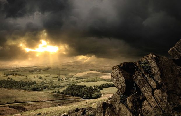A rocky ridge under a heavy sky